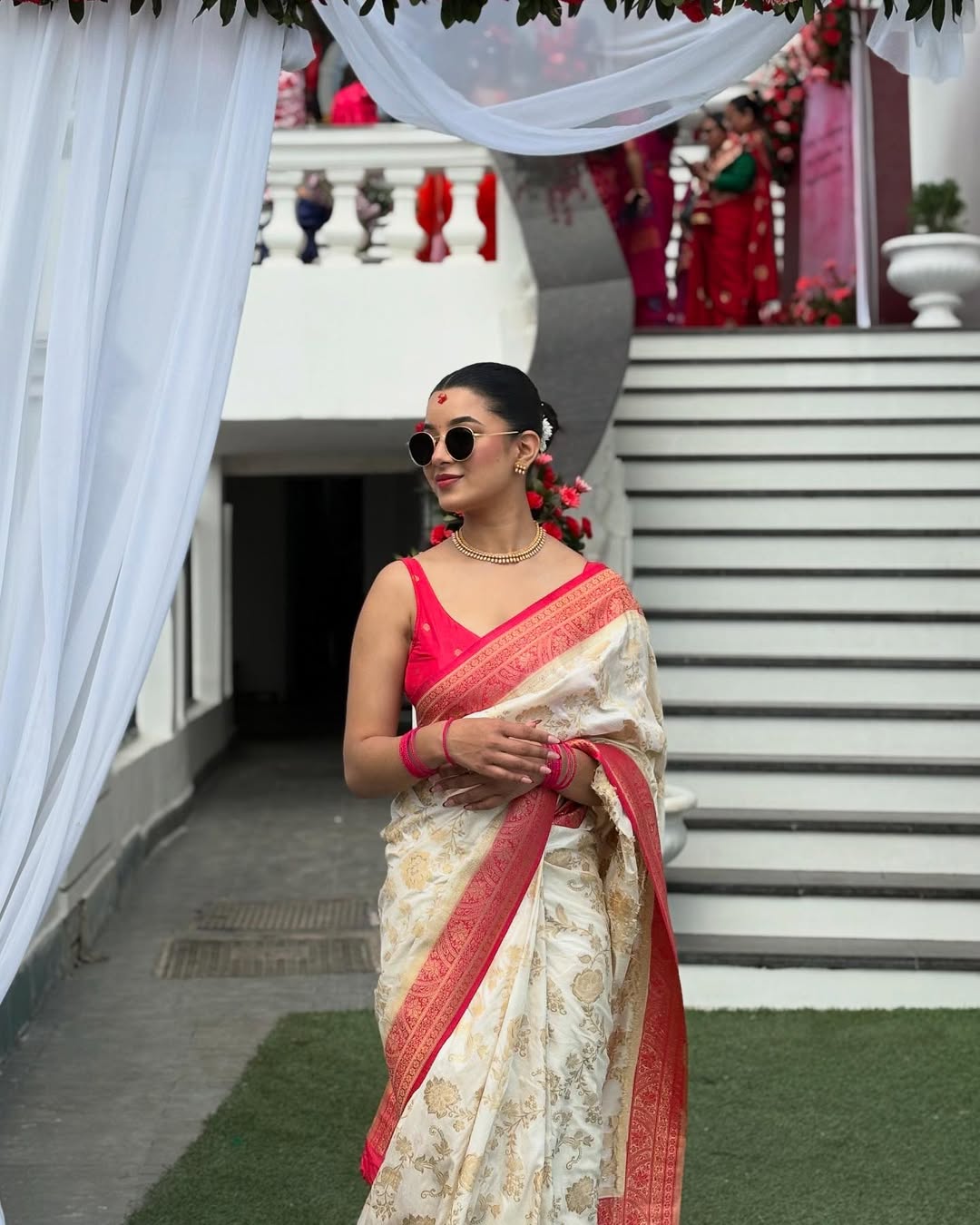 Elegant White Silk Saree with Gold Motifs & Red Border