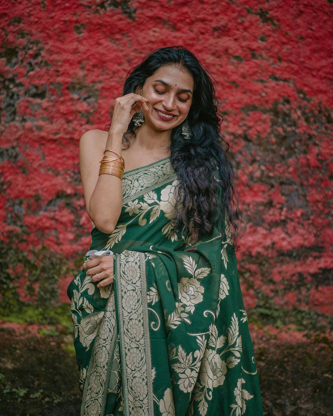 Elegant Green Silk Saree with Gold Floral Design