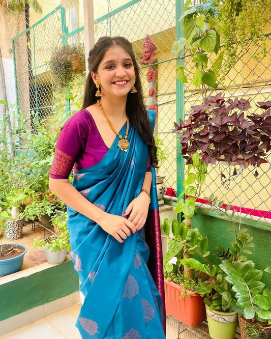 Graceful Teal Saree with Rich Purple Pallu