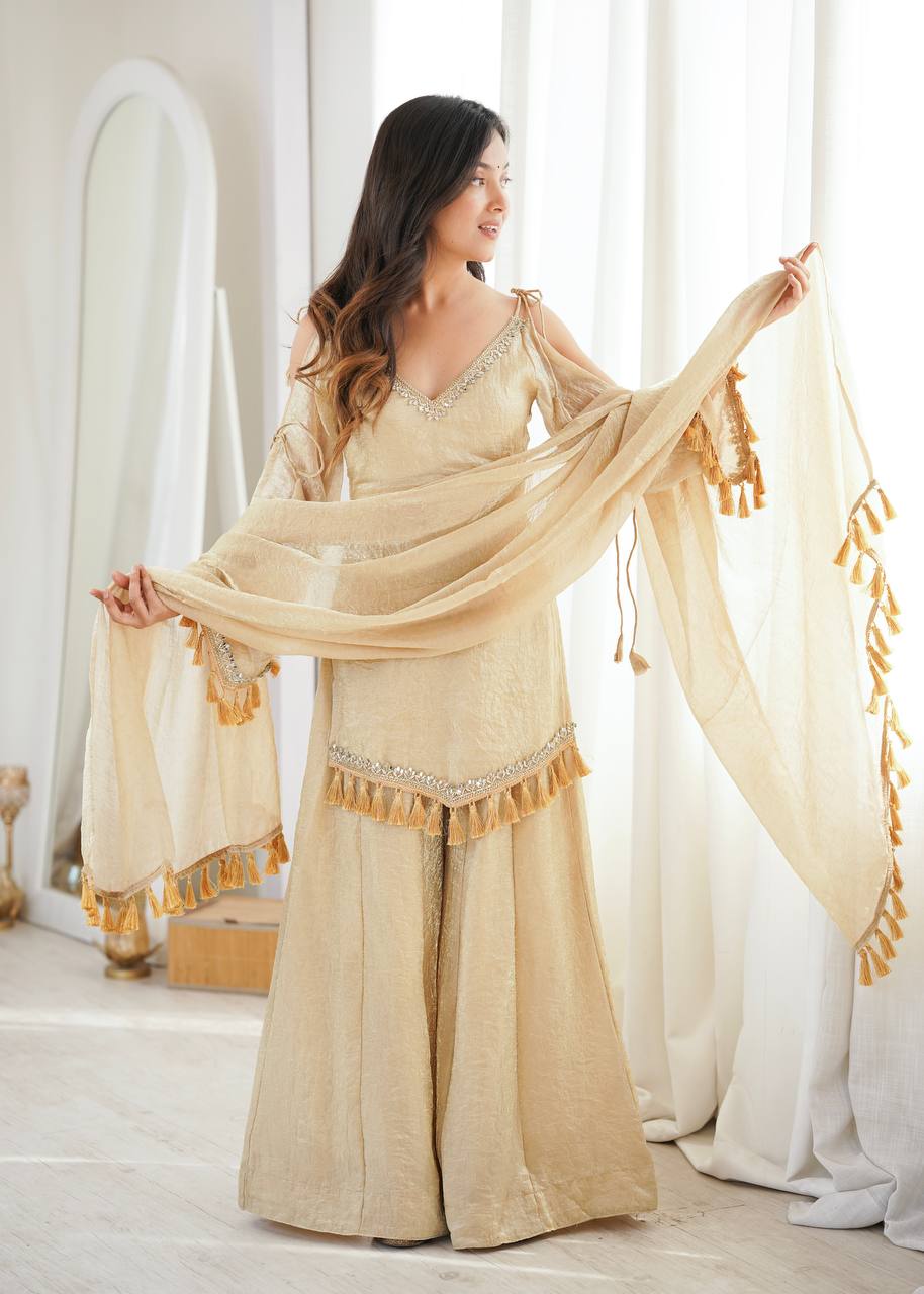 Beige Gold Tissue Silk Sharara Set with Cold-Shoulder Kurta & Tassel Dupatta