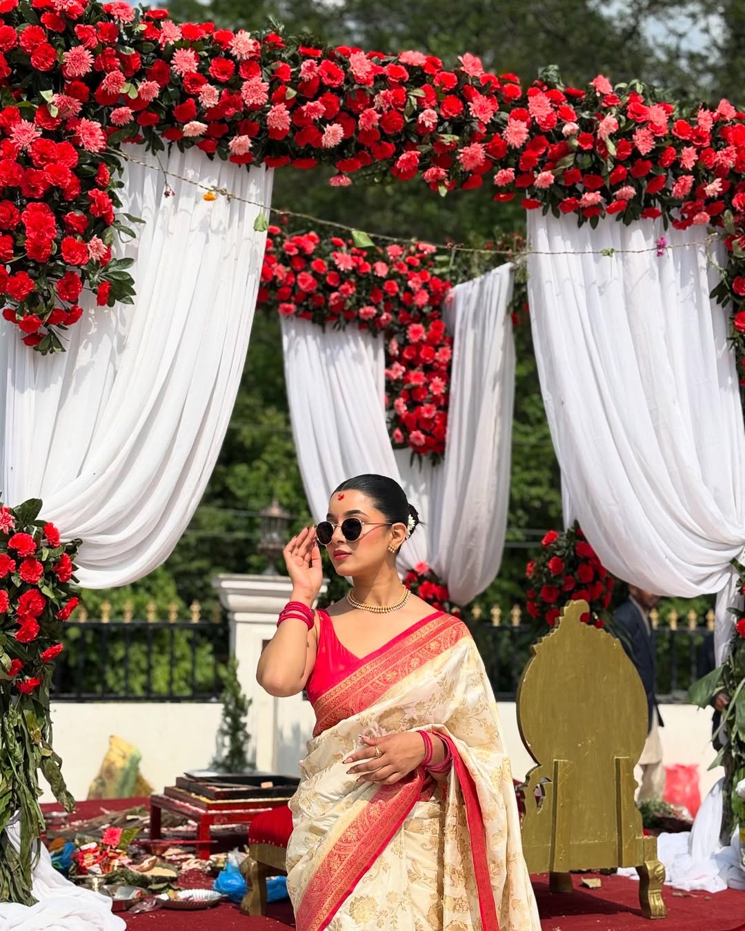 Elegant White Silk Saree with Gold Motifs & Red Border