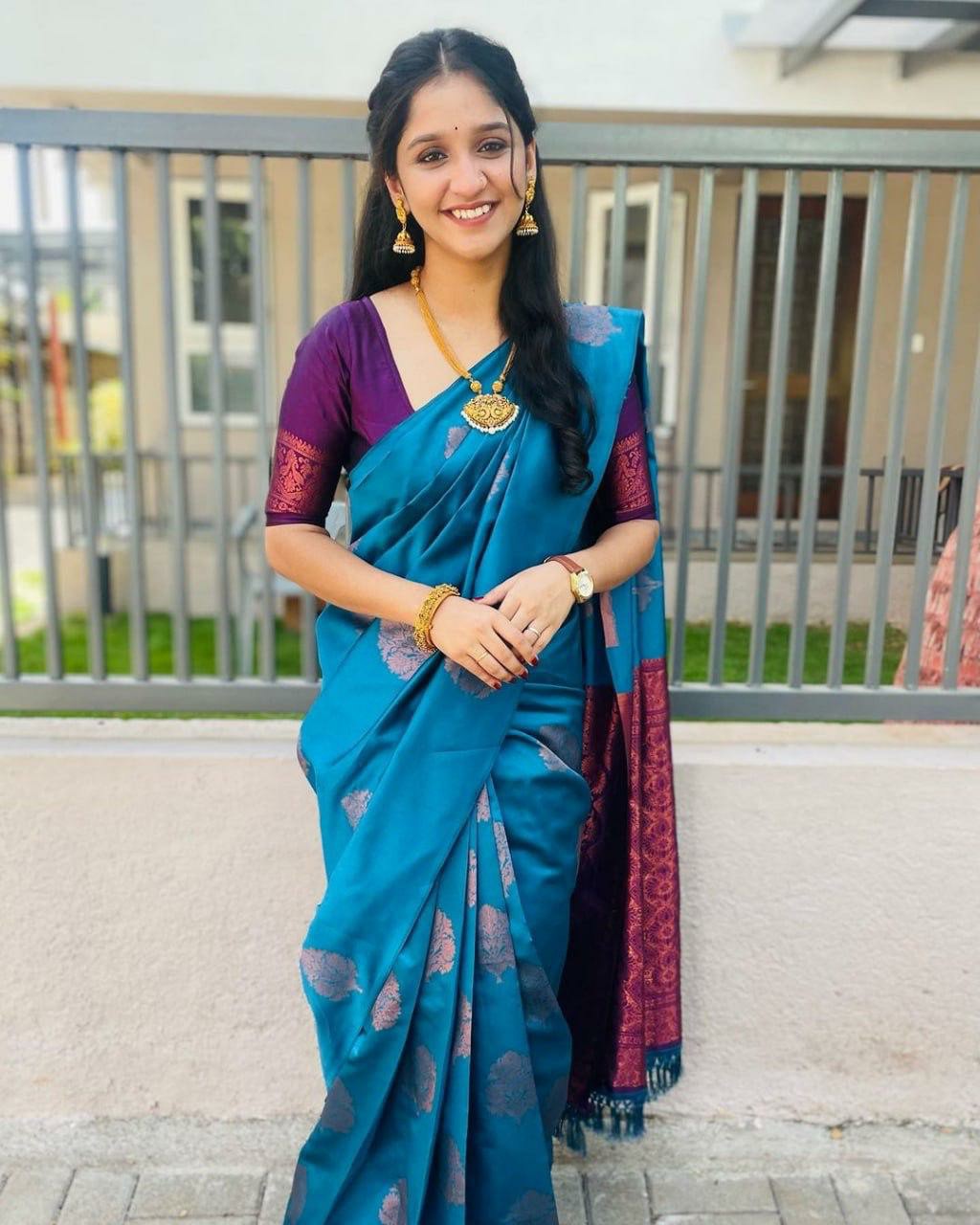 Graceful Teal Saree with Rich Purple Pallu