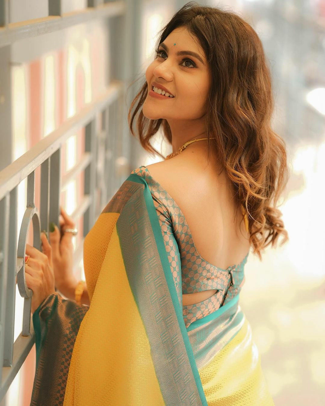 Yellow Silk Saree with Teal Green Border