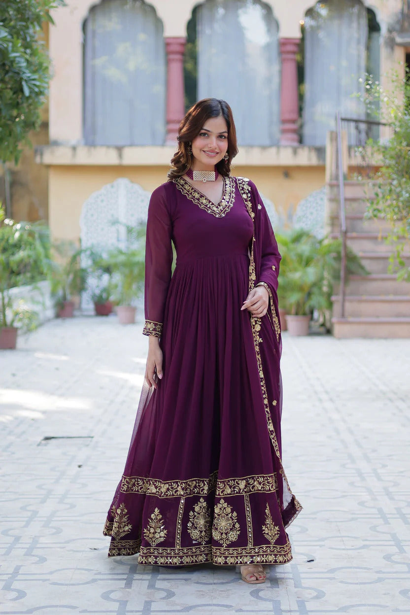 Deep purple plum georgette flared Anarkali suit set with gold zari embroidered V-neckline, hem border, and heavy embroidered dupatta
