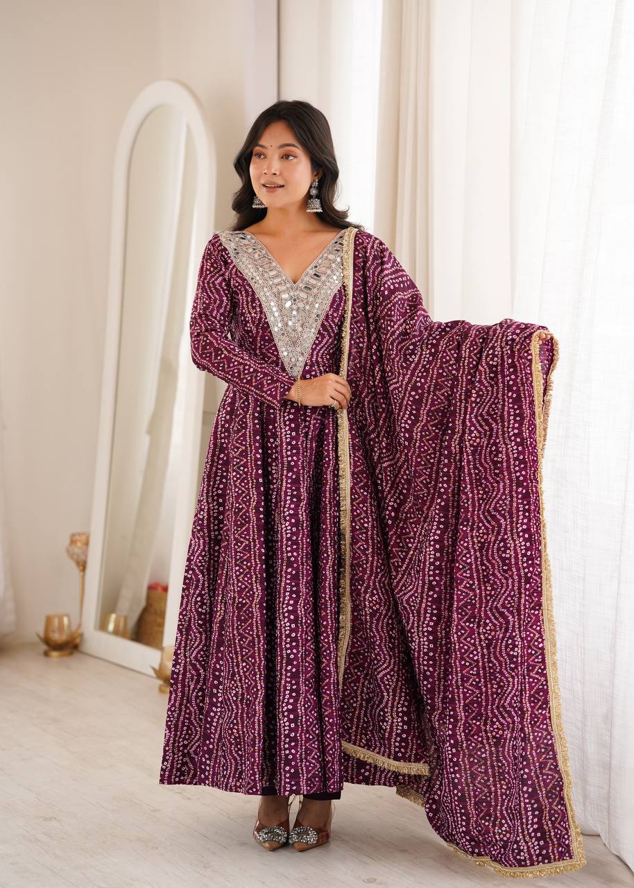Deep wine purple Bandhani print Anarkali kurta set featuring heavy mirror work embroidery