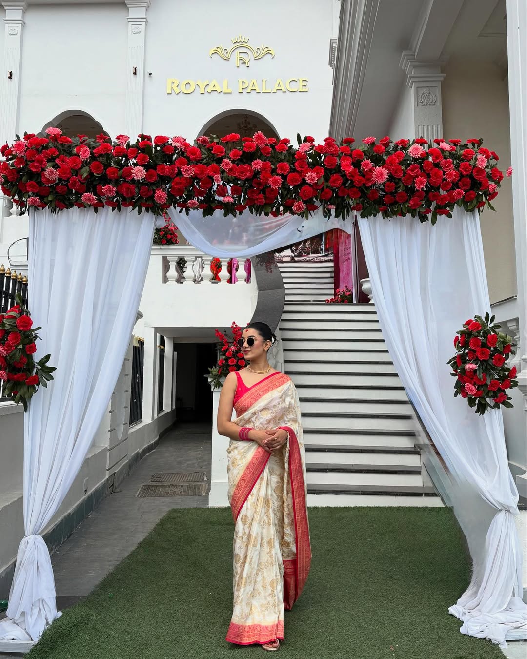 Elegant White Silk Saree with Gold Motifs & Red Border